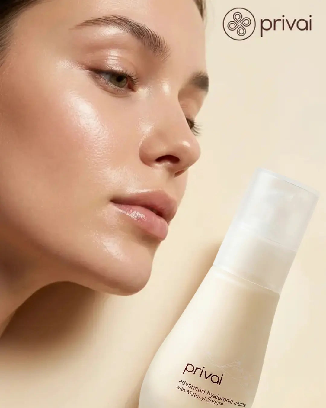 Close-up of a person's face with a bottle of privai skincare product on a beige background
